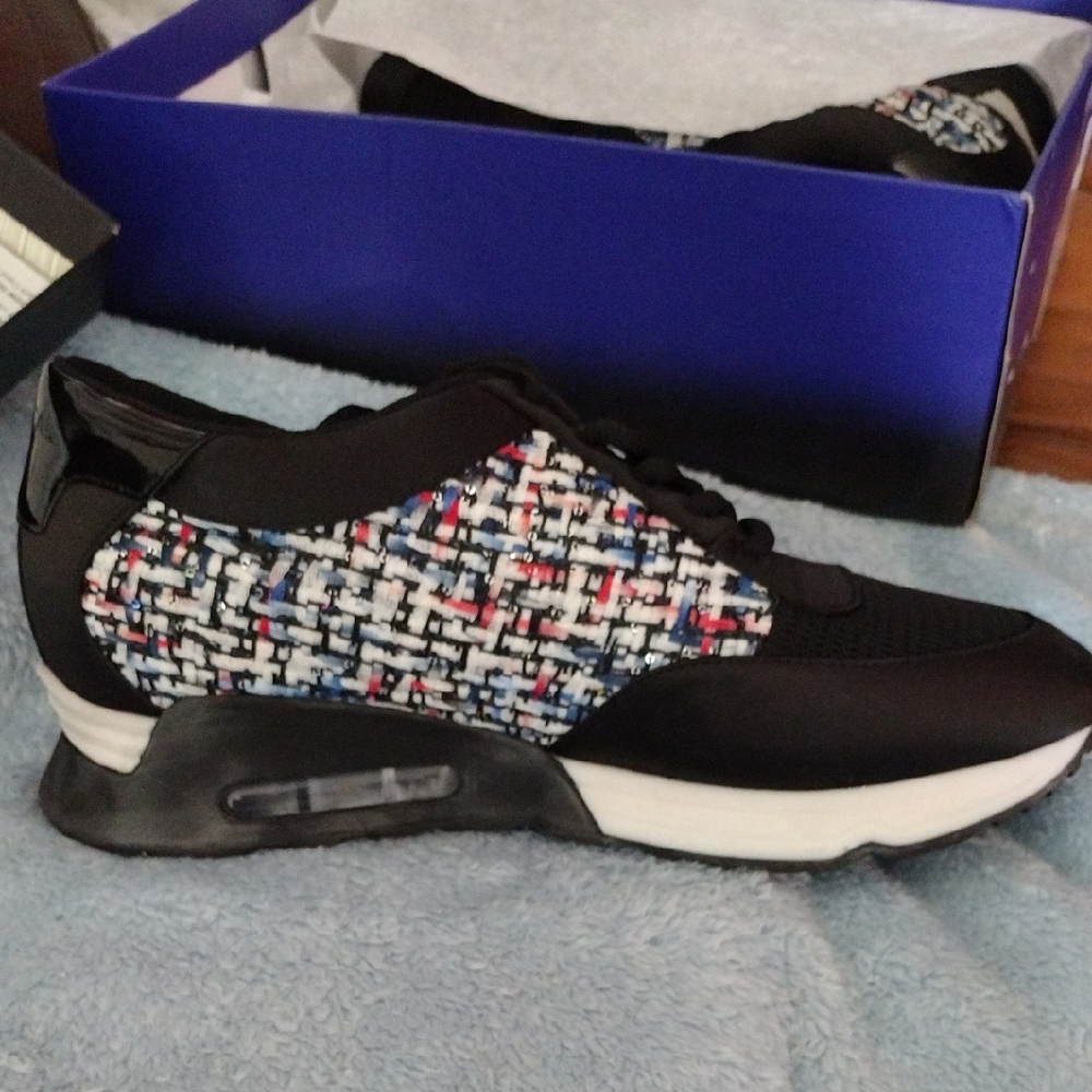 Black and Red Sneakers with Visible Air Cushioning